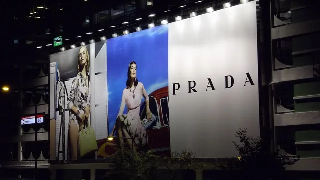 advertising, prada, billboard, advertisement, outdoor, prada, billboard, billboard, billboard, billboard, billboard. Cardiff OOH buying under Welsh language and devolved policy rules
