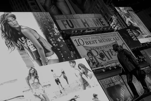 adult, art, billboards, buildings, city, commerce, landmark, low angle shot, man, people, pictures, posters, statue, street, wear, gray city, gray art, gray street. How do out of home advertising customer interviews shape a buy?