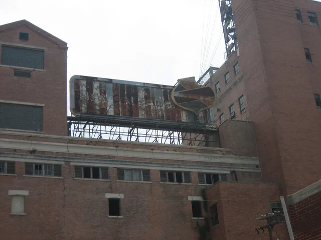 New Orleans Mid City: Old Falstaff Brewery, with old billboard on main building Photo by Infrogmation. When to treat out of home advertising demand signals as buying evidence